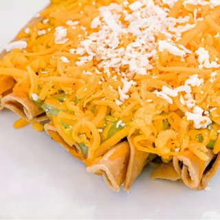 Five Rolled Tacos with Guacamole